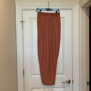 Rick Owens long coral skirt with high slit and elasticized drawstring waistband.